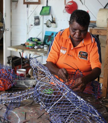 The collection Ghost Net Totems by Pormpuraaw Arts and Cultural Centre (featuring Simone Arnol designs) shown as part of the Cairns Indigenous Art Fair Fashion Performance: Water is Sacred, 2020