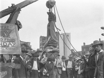 Murray the escapologist in a straight-jacket, 1928 by Sam Hood