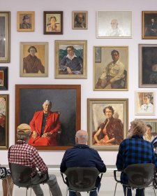 People viewing portraits in Gallery One