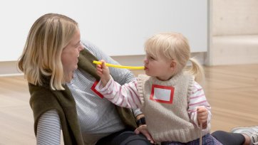 A mother and daughter participating in Portrait Play