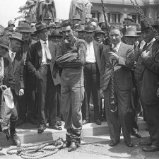 Murray frees himself from straightjacket in public, 1928 by Sam Hood