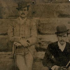 William St Leonards Robertson (standing) beside an unidentified man