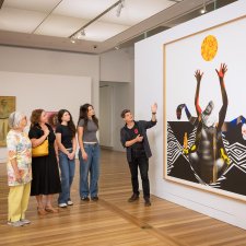 People looking at an artwork in the Gallery